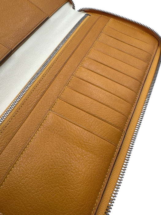 Tumi Orange Leather Zip Around Pebbled Wallets Orange